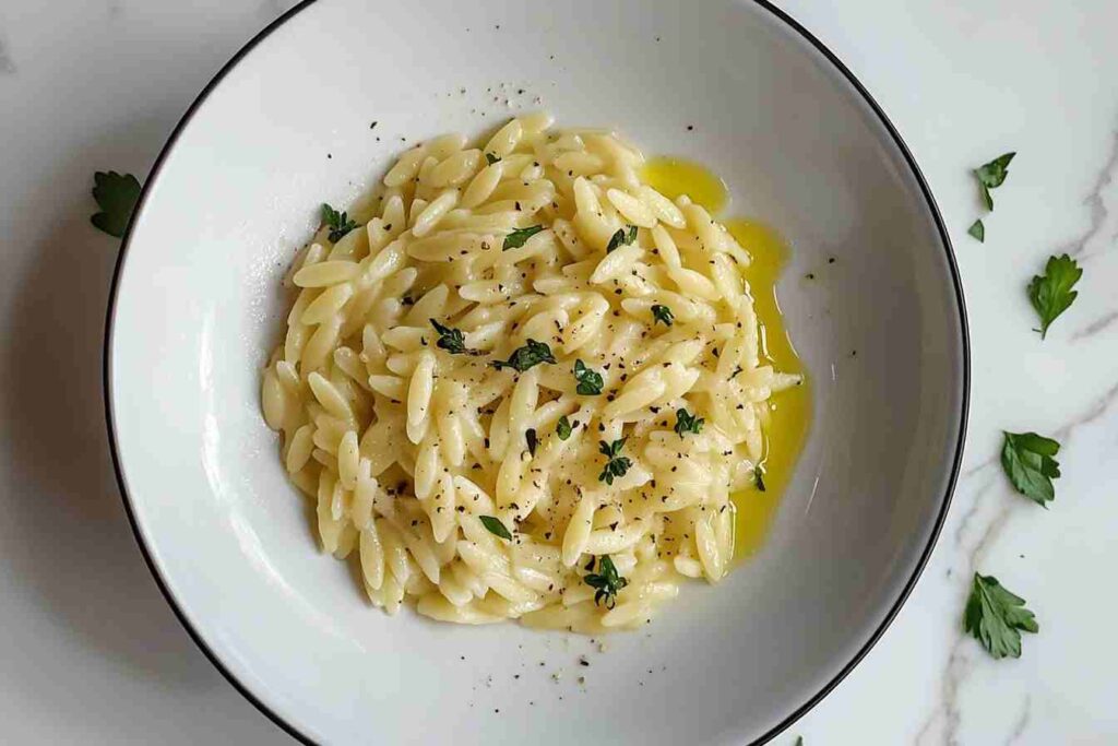 Freshly cooked orzo pasta with herbs and olive oil