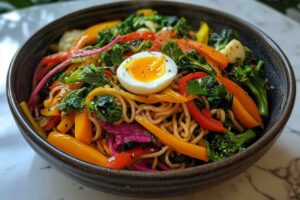 Steaming bowl of noodle mag with vegetables and egg
